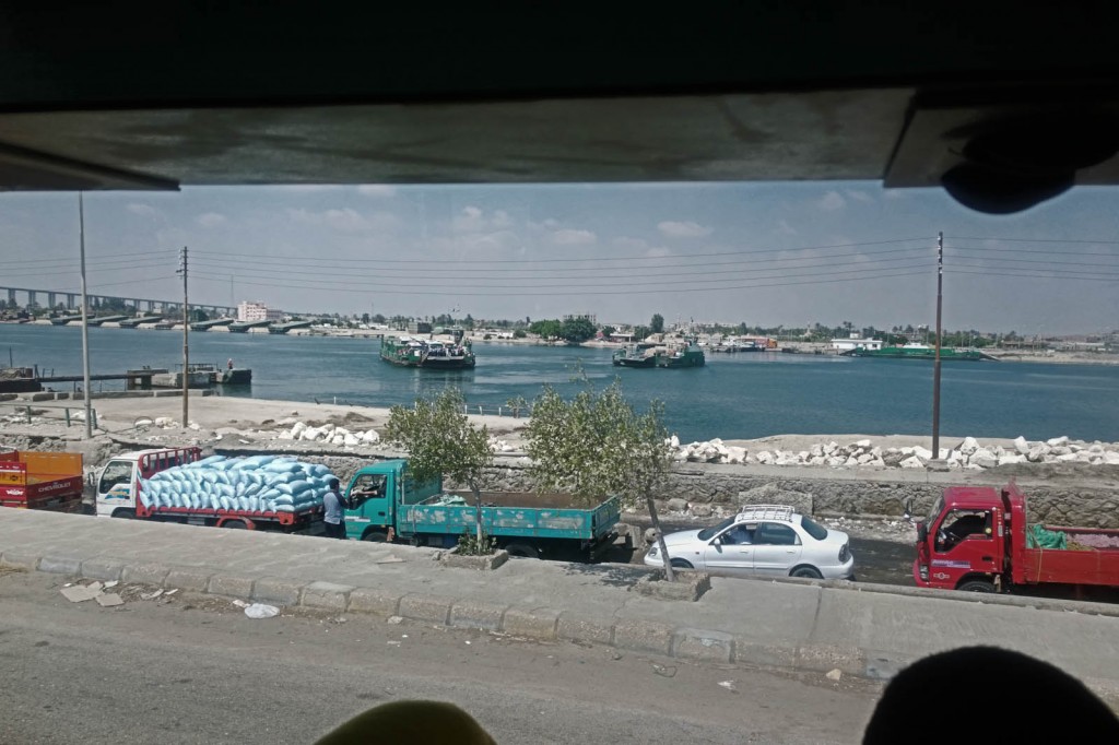 The convoy's buses cross the Suez Canal towards al-Balouza checkpoint.