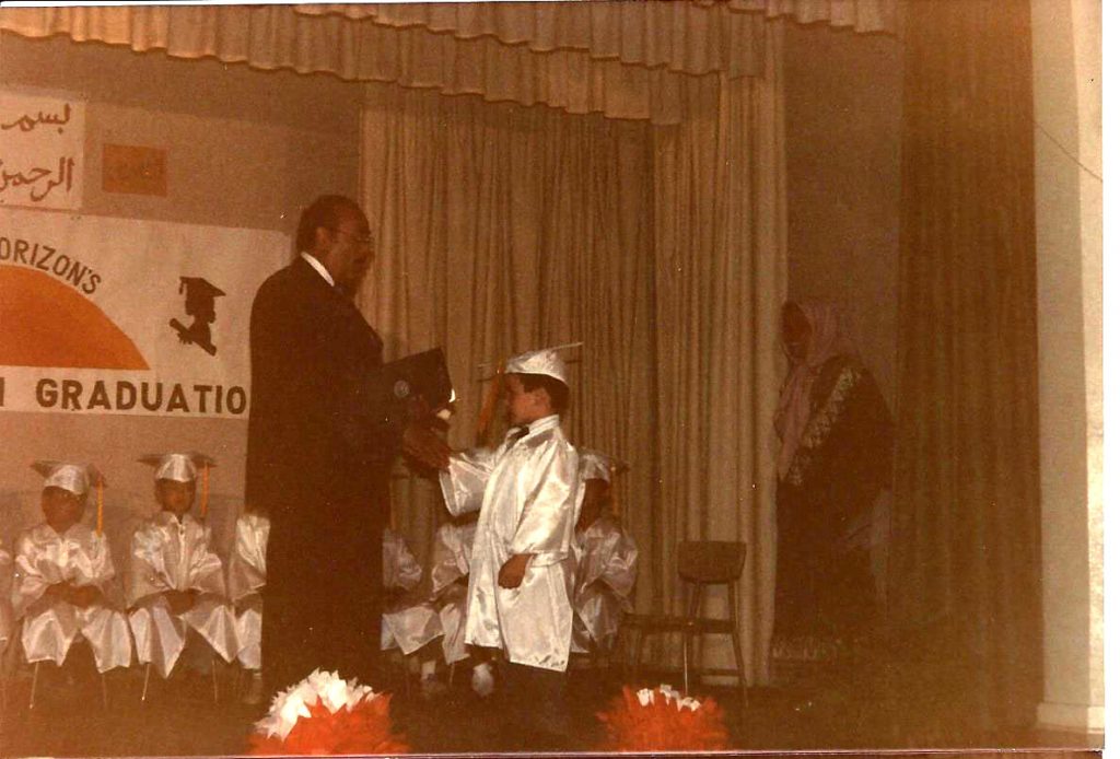 Dr. Hathout presents diplomas to students at the New Horizon School in 1987