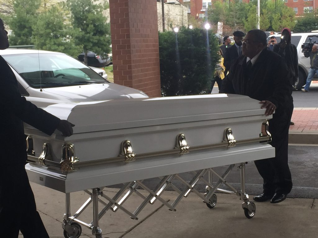 The casket of Freddie Gray arrives at the church and is transported to the hall. 