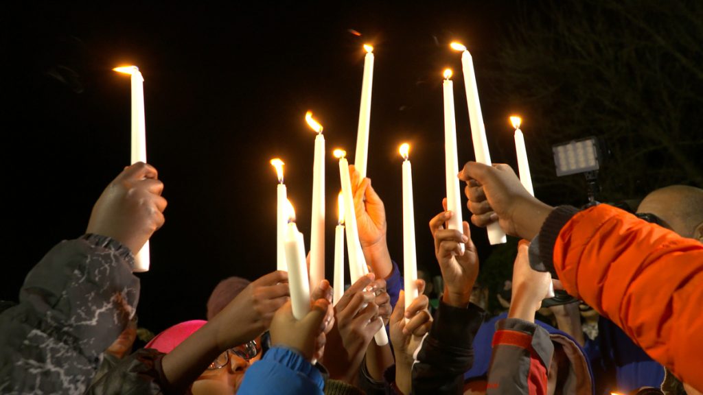 Children hold up candles at a vigil for victims of the San Bernardino shootings at the Silver Spring Muslim Community Center in Silver Spring, Maryland. >Photos courtesy of Jay Mallin