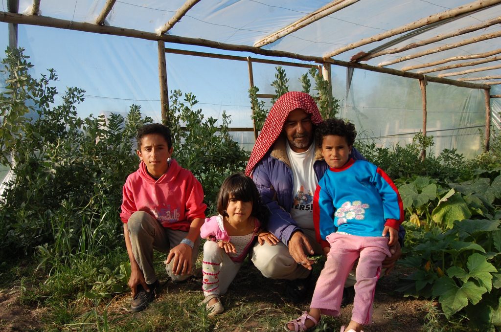 Merhi Alshebli with some of his children at their home in Juan Lacaze. He has said that he would farm if he had more land. He has barely a hectare right now. >Taylor Barnes